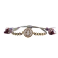 Detail of colorful woven Hamsa bracelet featuring a gold-plated hand with zircon inlays - New Bead Chain