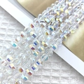 Macro shot of 8mm faceted glass beads with rainbow iridescent luster for DIY jewelry - New AB Color