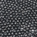 Macro shot of black acrylic flat beads with white uppercase letters for jewelry DIY - Black & White Letters