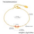 Detailed view of kids butterfly bracelet with pink and white enamel in gold stainless steel - Gold Butterfly Enamel Bracelet (TXE260)