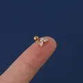 Mini heart-shaped gold piercing earring with clear zircons held on a fingertip - Gold Base White Zirconia (302-2#)