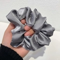 Elegant grey satin scrunchie with delicate pearl embellishments on a rich pleated texture - Gray