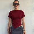 Detailed view of the asymmetrical hemline and dark red knit fabric on this slim-fit T-shirt - S / Burgundy