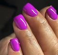 Close-up of glossy magenta purple square press-on nails with a high-shine mirror finish - Purple Glossy Square Style (CW298)