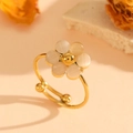 Adjustable golden ring featuring a white cat eye stone flower with six petals - Gold White Cat's Eye Ring