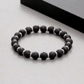 Close-up of black porous lava stone beads with steel spacer discs on a beaded bracelet - Lava Stone (KB183243-TLX)