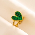 Detail of a golden heart ring featuring a green malachite style stone on beige fabric - Gold Tone-Green Malachite Look (J549-G-G)