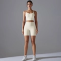 Front view of beige high-waist yoga set with thin strap sports bra and seamless shorts - S / Light Ivory
