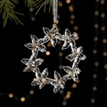 Clear acrylic Christmas wreath ornament with gold sequins on a festive pine branch - Crystal Wreath