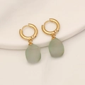 Macro detail of gold cross charm on light green natural stone earring with metal loop - Green Aventurine (9#)