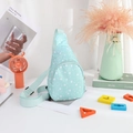 Detail of light blue nylon kids chest bag featuring white star prints and a zipper closure - Star