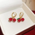 Detail shot of cherry earrings with red stones and gold cubic zirconia in a jewelry box - Spherical Bead Red Cherry Hoops (Real Gold Plated)