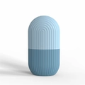 Blue silicone ice roller for facial skincare with two-tone capsule shape and grooved texture - Wave Texture Pale Blue