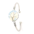 Close-up of silver wire-wrapped Tree of Life design on a crystal stone bangle - Silver + Opal