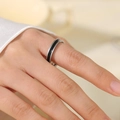 Sleek silver stainless steel ring with black inlay on a hand model for a modern look - Size 5 / Steel Black Enamel