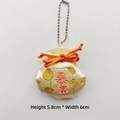 Detail view of 5.8x6cm embroidered fortune pouch with tassel and orange knot - Get Rich (Chain Version) / Yellow