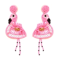 Handmade pink beaded flamingo drop earrings with gold gemstones on white background - Pink
