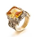 Retro punk gold steel ring featuring a large square yellow gemstone with fleur-de-lis detail - Gold Yellow