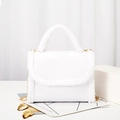 White croc-effect handbag featuring white faux fur trim and elegant gold chain strap - White