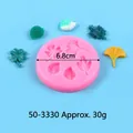 Detailed view of 6.8cm round silicone mold with various leaf shapes for DIY crafts - Detailed Leaf Shape (50-3330) / Pink