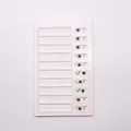 Detail view of white plastic RV checklist memo board with 10 sliders for daily task tracking - Blank No Logo Style (Blank Style)