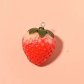 Realistic red resin strawberry fruit pendant with green leaves and metal hook on pink background - No.4 Large Strawberry Gold Loop