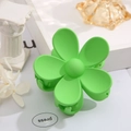 Detail of green matte flower hair claw clip on aesthetic white decorative background - Green