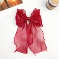Detail of elegant dark red organza bow hair clip with long ribbons and premium texture - Shiny Silk Ribbon Bow / Burgundy