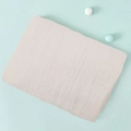Pale pink double layer cotton muslin swaddle blanket with subtle grid texture - Beige