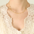 Elegante 18k vergulde choker ketting met delicate hartvormige hangers aan een schakelketting - Gouden Hart Ketting / 40+5cm
