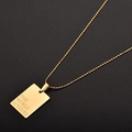 Golden stainless steel square tag necklace with The World Is Yours engraving detail - THE WORLD