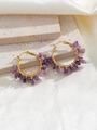 Detail of handmade bohemian gold wire wrapped hoop earrings with purple natural stones - Purple