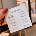 Close-up of 6-pair mini earring set with heart and flower designs on daily display card - E1540-1 Rainbow Heart Bow Style