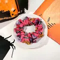 Pink satin Halloween scrunchie with festive pumpkin, bat, and tombstone patterns - Pumpkin Pink / Small Size