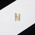 Gold plated letter N pendant accessory featuring micro-pave cubic zirconia crystals - Letter N