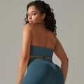 Detail view of seamless backless sports bra and high waist leggings in dark cyan ribbed fabric - S / Top And Bottom / Teal