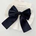 Large black satin bow hair clip on a white ceramic plate for an elegant French style - Black Satin Bow Hair Clip / Black