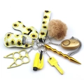 Macro shot of yellow sunflower neoprene keychain set with safety alarm and pompom - Sunflower Yellow