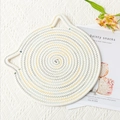 Detailed close-up of cat-eared woven placemat with colorful stitching on beige cotton - Cool Multi-color
