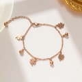 Elegant rose gold four-leaf clover bracelet with bell pendants on plain background - Lucky Four-leaf Clover Bell Style (960) / Rose Gold