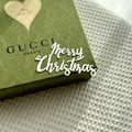 Close-up of green embossed GUCCI gift box with Happy Spring Time heart tag detail - Silver / Regular Style A / Plus Thick Style