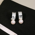 Elegant silver curved earrings featuring a lustrous round white pearl in minimalist style - Minimalist Silver Curved Pearl Style (E3782)