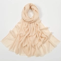 Detail of beige slub cotton scarf showing lightweight texture and fringe edges - Cream/Off-White