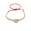 Adjustable red cord bracelet with gold beads and a sparkling zircon heart charm pendant - Gold Beads Red Rope Heart