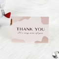 Pink abstract greeting card with THANK YOU text on a white plush background - Thank You Style