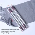 Metallische silberne Spiralkerzen im 4er-Pack in einer transparenten Box als Deko - Strömendes Silber Spiralkerzen (4er-Pack)