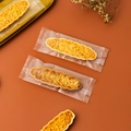 Caramel almond tart crisp in transparent plastic heat-seal packaging on a red background - Frosted Style / Pack of 100