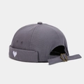 Close-up of heart embroidery and adjustable metal buckle on dark gray canvas docker hat - Fog Blue