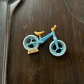 Blue and yellow mini balancing bike keychain accessory with movable plastic wheels - Medium / Blue