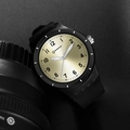 Sporty quartz watch featuring black case, black strap, and sunburst gold dial with numerals - Black Gold